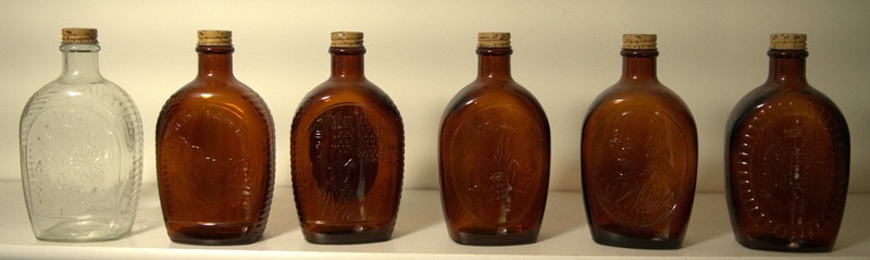 Vintage Log Cabin Syrup Commemorative Bottle Set – 6 Amber/Clear Embossed