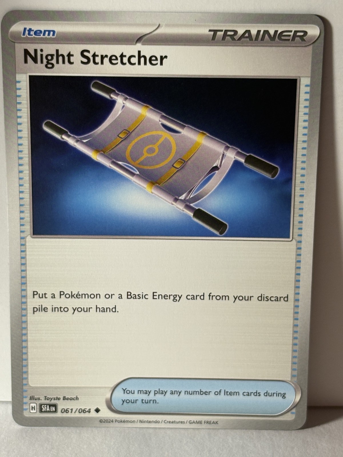 Night Stretcher Reverse Holo 061/064 SV: Shrouded Fable NM Pokemon Fast Ship