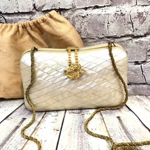 gold hard case clutch bag