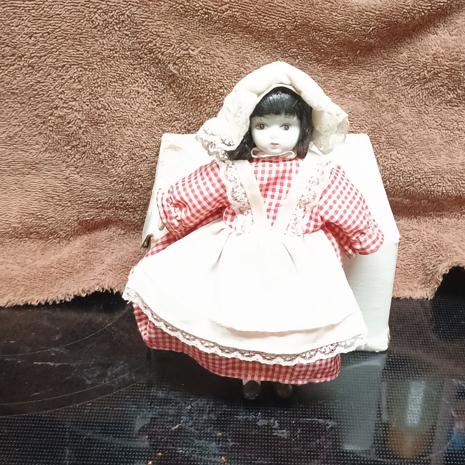 Porcelain Girl Doll Black Hair Red Gingham Dress White Apron Bonnet