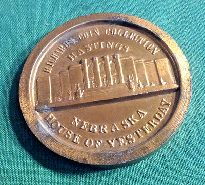 Old Lucky Nickel Coin-Like Thick Metal Paperweight Advertising Hastings Nebraska