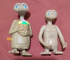 2 Vintage E.T. Extra-Terrestrial. One with Flowers Wind-Up. Action Figure Toy