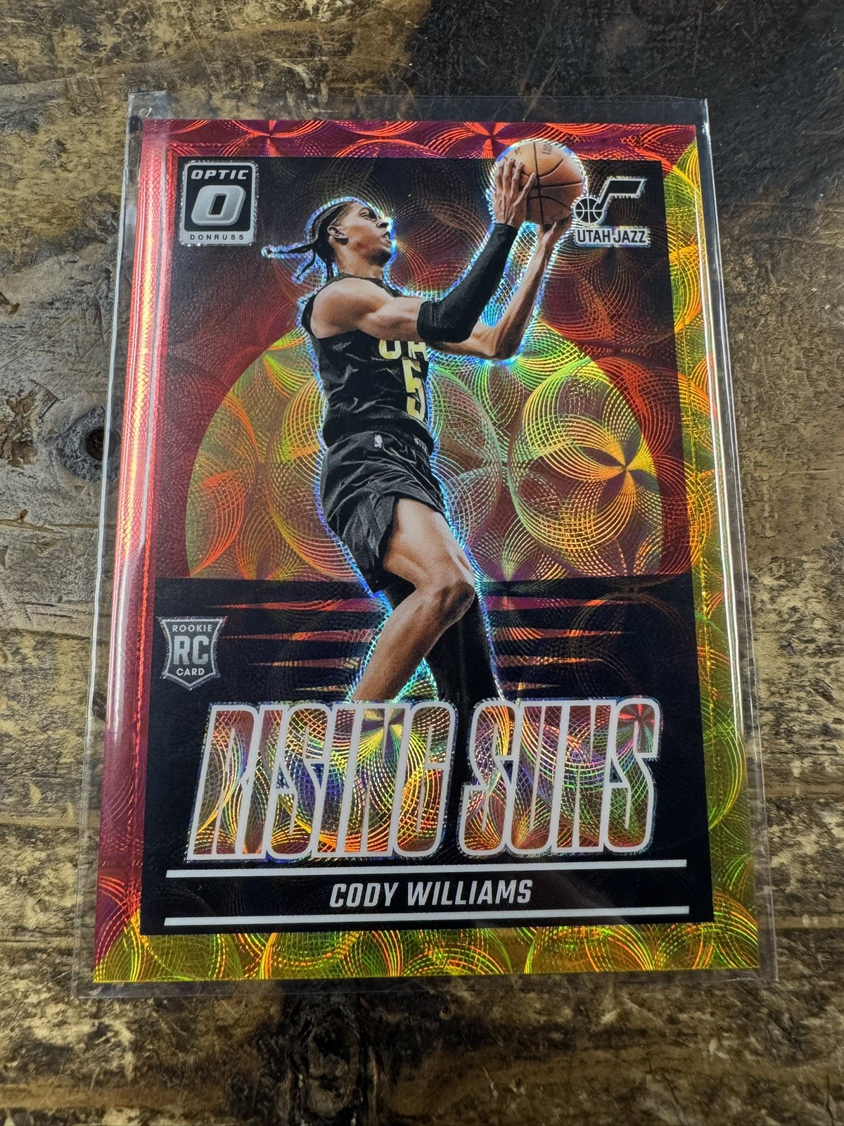 2024-25 Panini Donruss Optic - Rising Suns Cody Williams #8 Red Prizm /99 (RC)