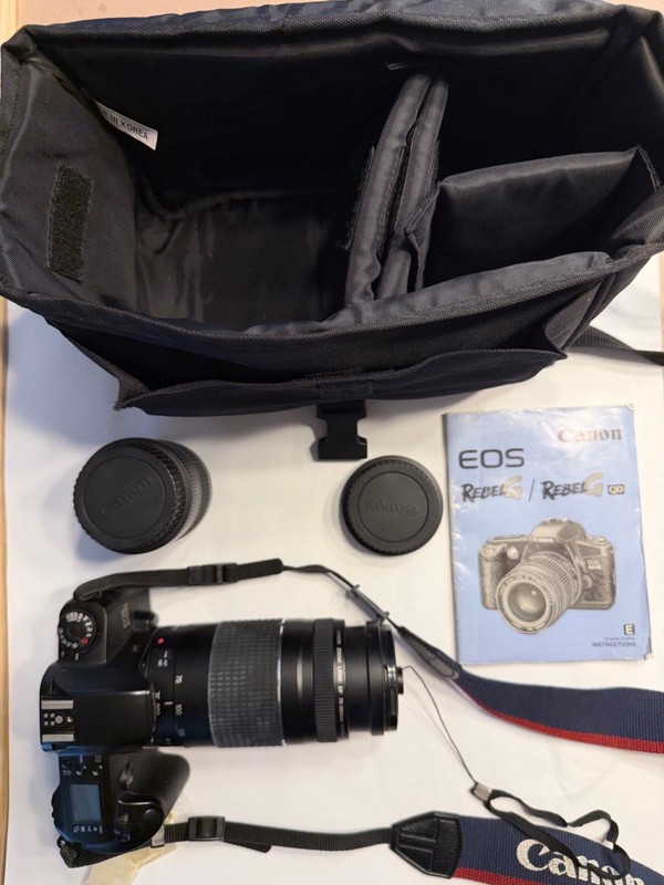 Canon EOS Rebel G, 2 lenses (35-80 and 75-300 mm), camera bag, and user manual