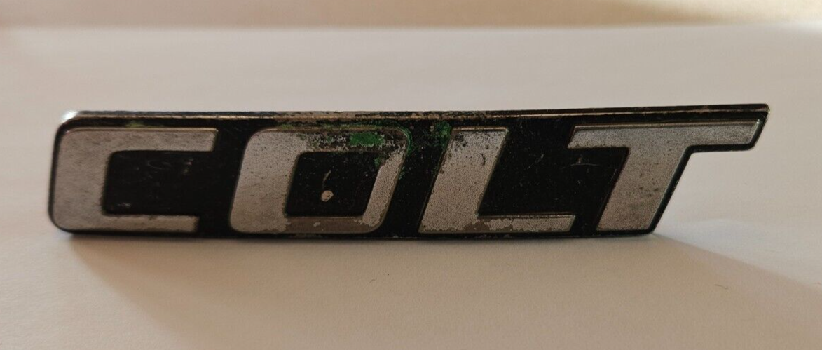 1987-1988 Dodge Colt Grill Emblem - P/N MB608 253 - With Pins