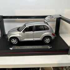 Vintage Daimler Chrysler 2000 chrysler pt cruiser with spotlight display