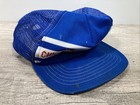 Blue snapback trucker hat with white and red stripe, embroidered “VTG Chicago Cubs” text in red and white on front.