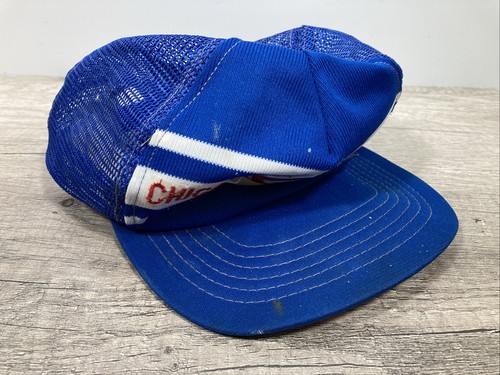 Blue snapback trucker hat with white and red stripe, embroidered “VTG Chicago Cubs” text in red and white on front.