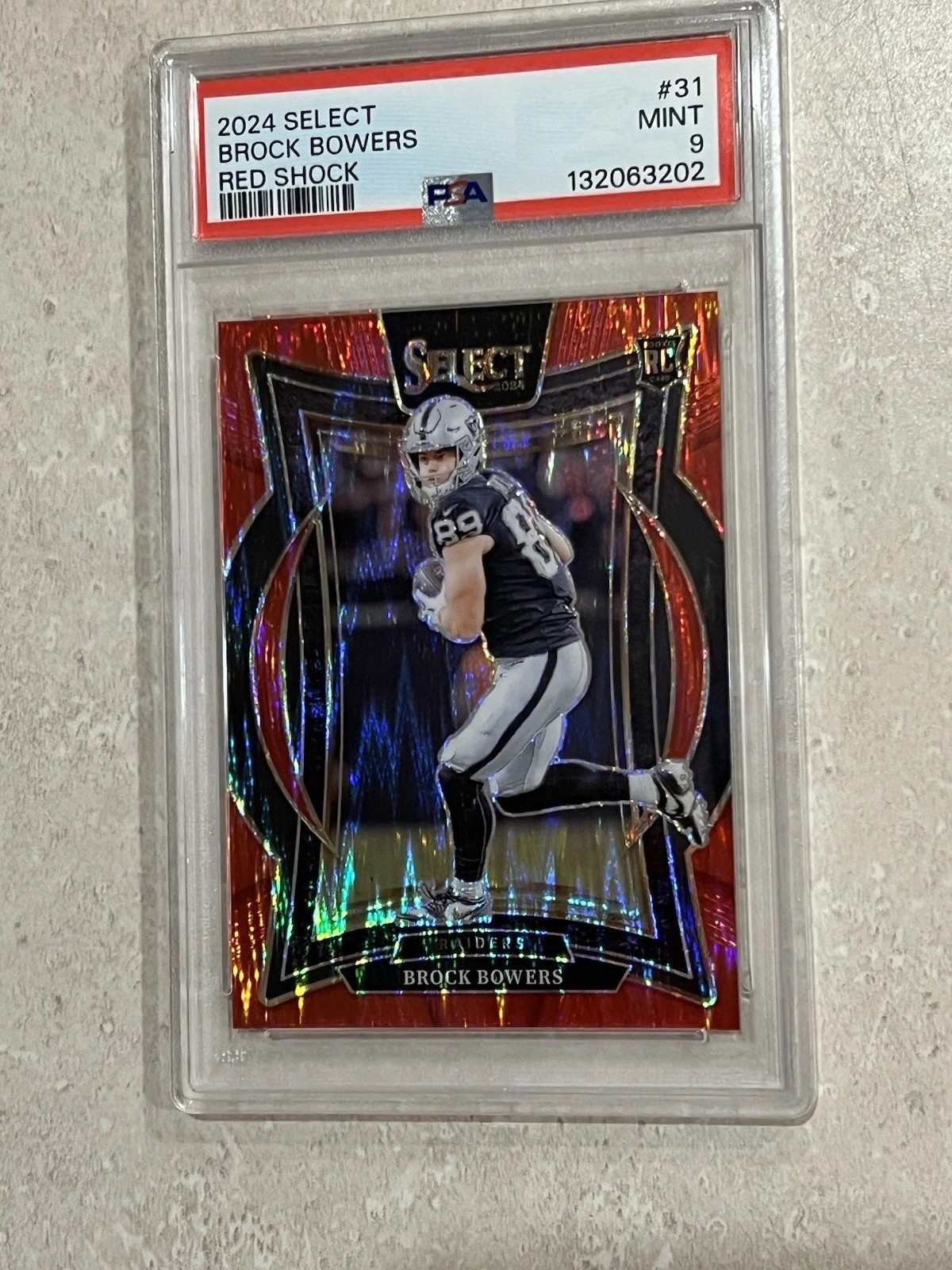 PSA 9 - 2024 Panini Select - Club Level Brock Bowers Red Shock Prizm /249 (RC)