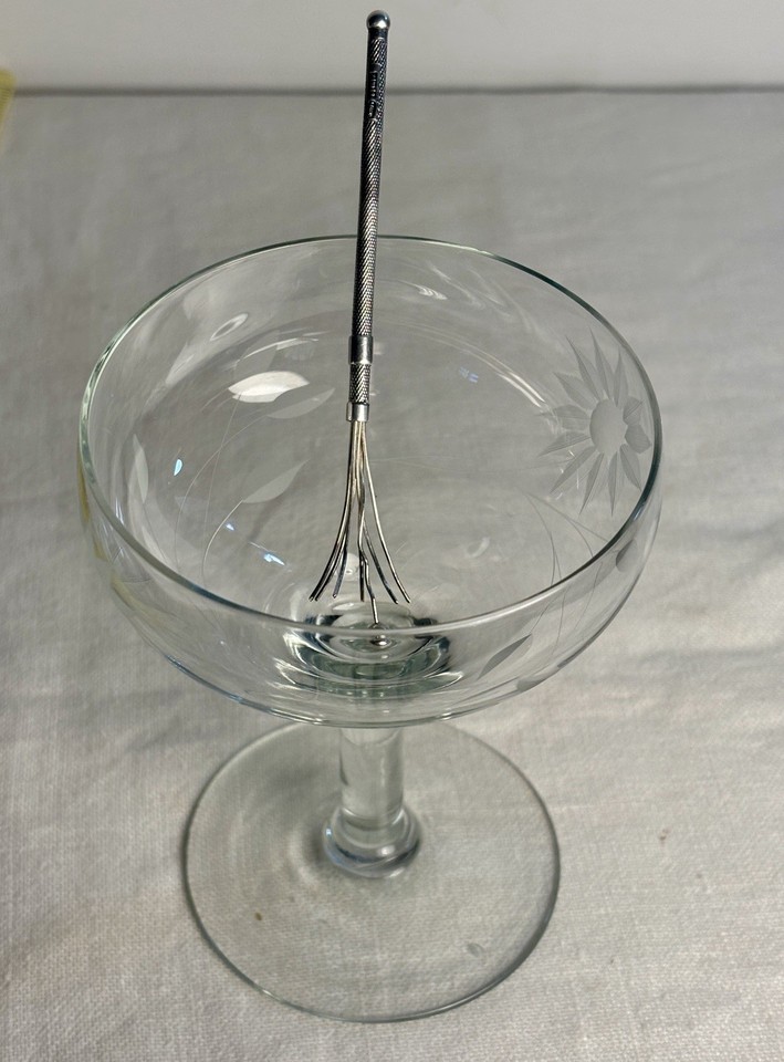 A 1930s Art Deco sterling silver retractable swizzle stick from England — a pocket-sized relic of a more glamorous drinking era.