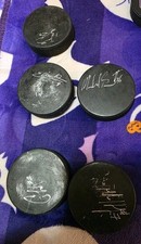 7 Autographed Hockey Pucks Signatures Unknown