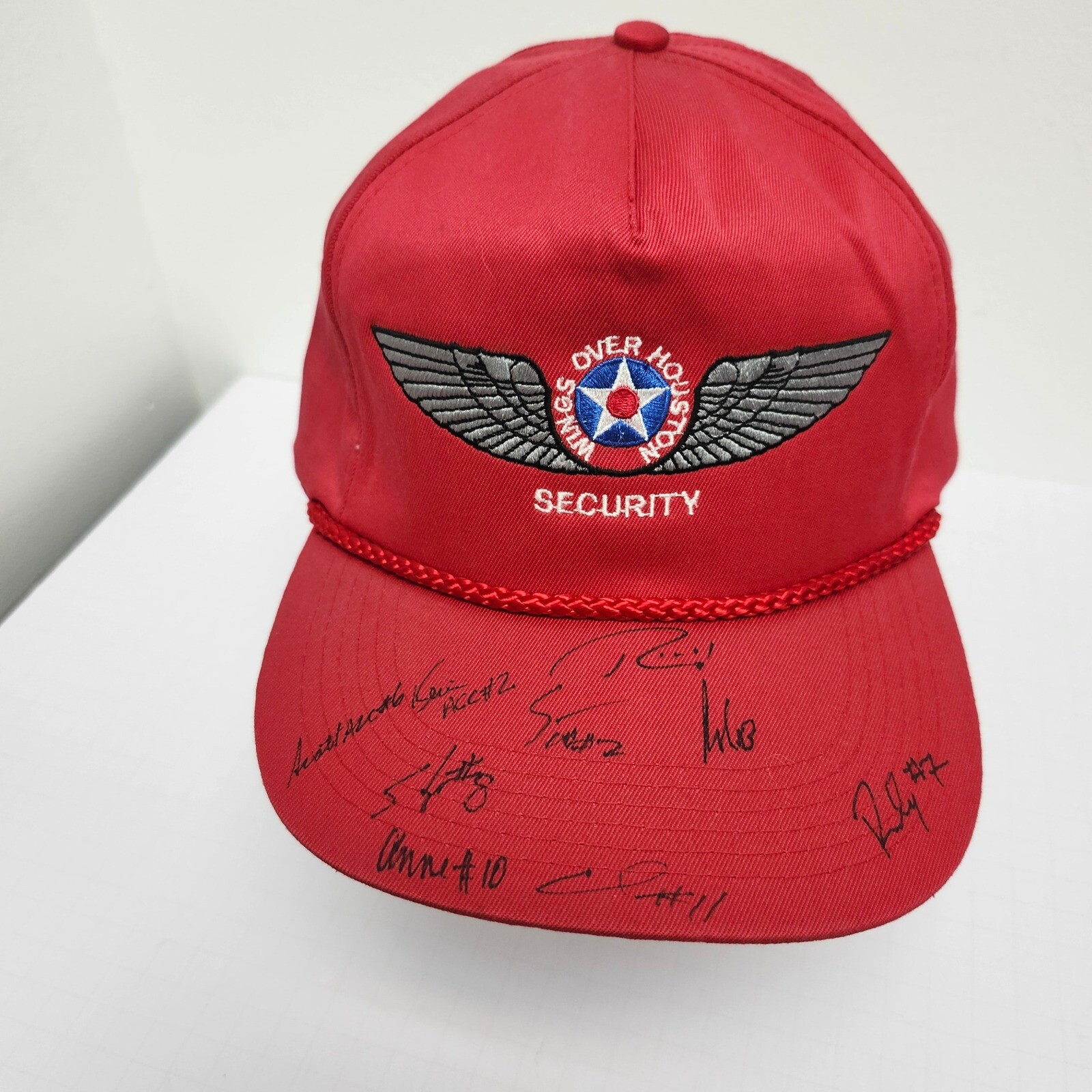 Wings Over Houston Security signed red snapback cap with autograph