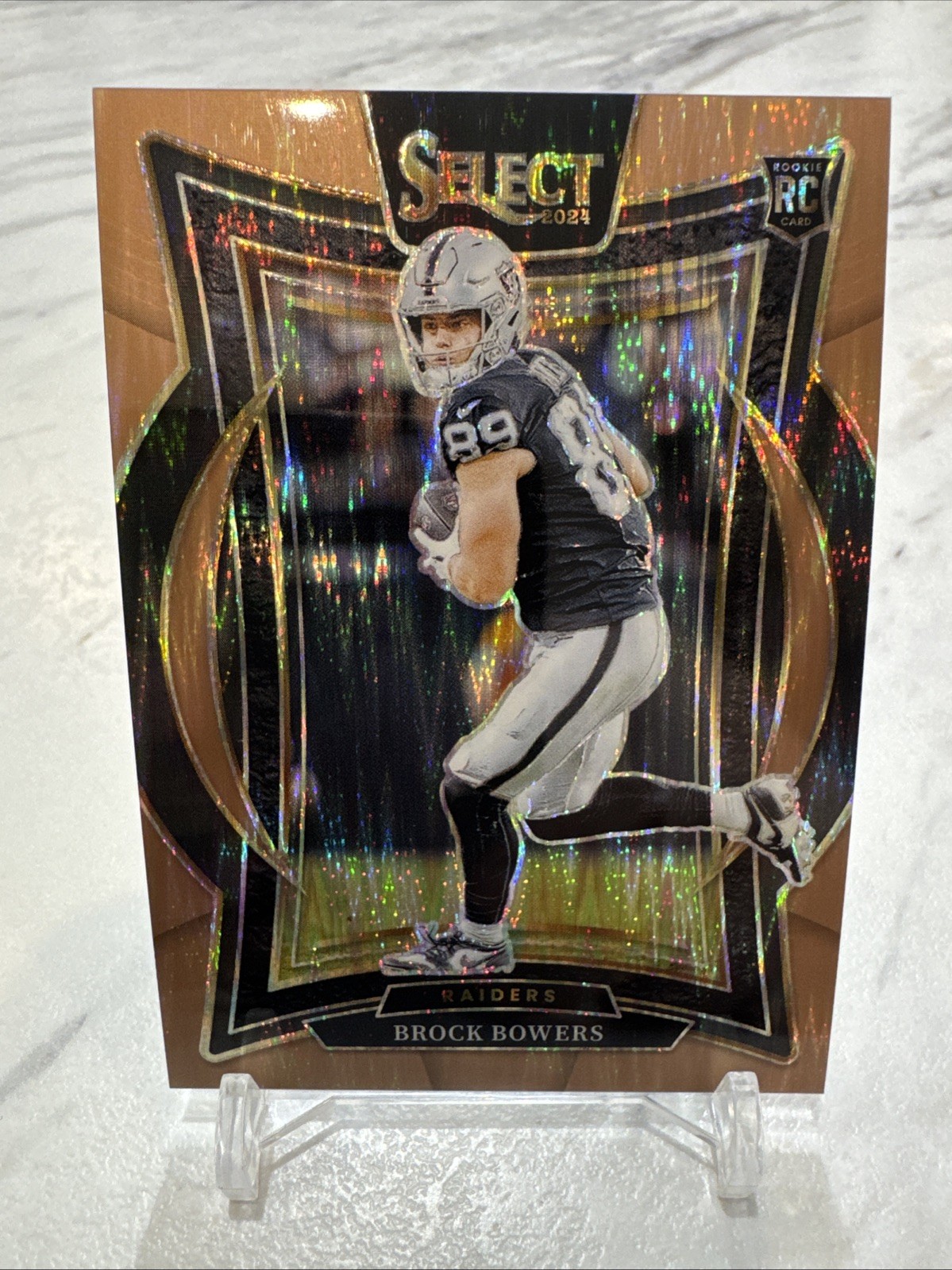 2024 Panini Select - Concourse Brock Bowers #31 Copper Shock Prizm /299 (RC)