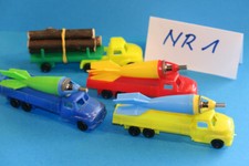 4x PLASTIK LKW mit AMORCES Raketen bel. Jean,...