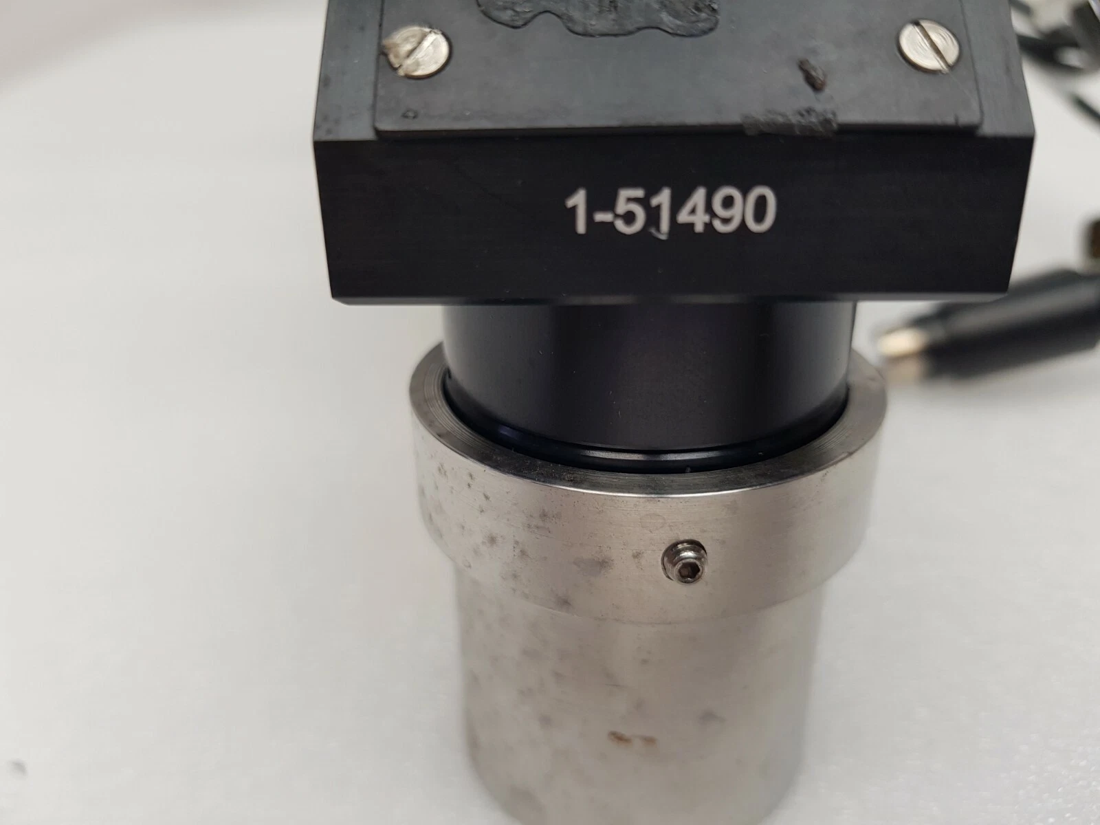 Navitar 1-51490 right angle attachment above a stainless sleeve