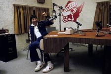 Coach Jim Valvano of North Carolina State in the broadcast office - Old Photo