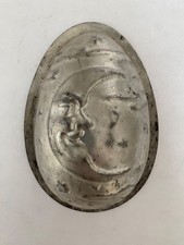 ANCIEN MOULE À CHOCOLAT FORME OEUF DÉCOR LUNE FER BLANC ANTON REICHE ?
