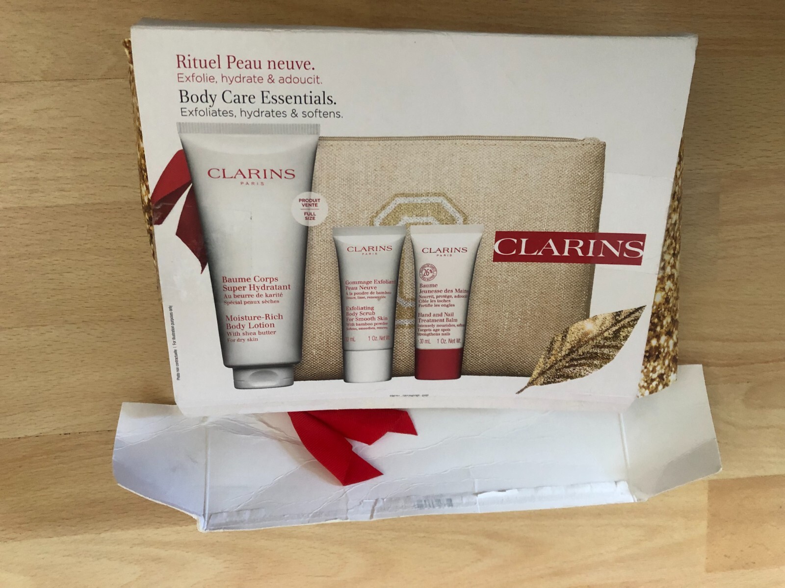 CLARINS BODY CARE ESSENTIALS GIFT SET, NEW BUT DAMAGED BOX, BODY LOTION