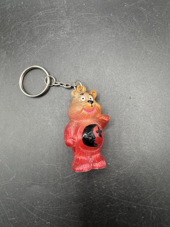 A translucent pink Care Bear-style moon & star keychain straight out of the 90s — tiny, nostalgic, and impossibly charming as a stocking stuffer.