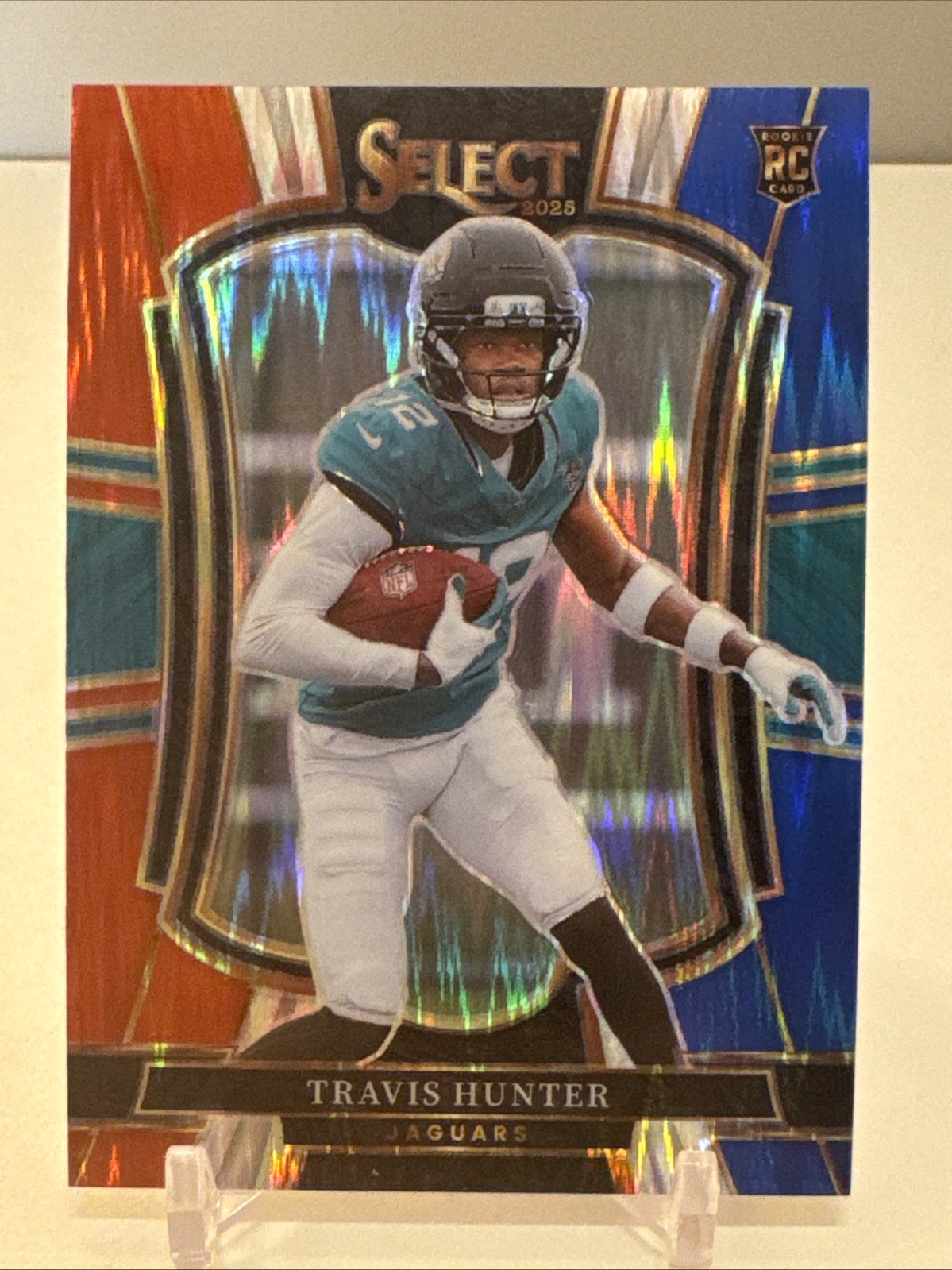 2025 Panini Select Travis Hunter #128 Premier Level Red & Blue Shock Prizm RC