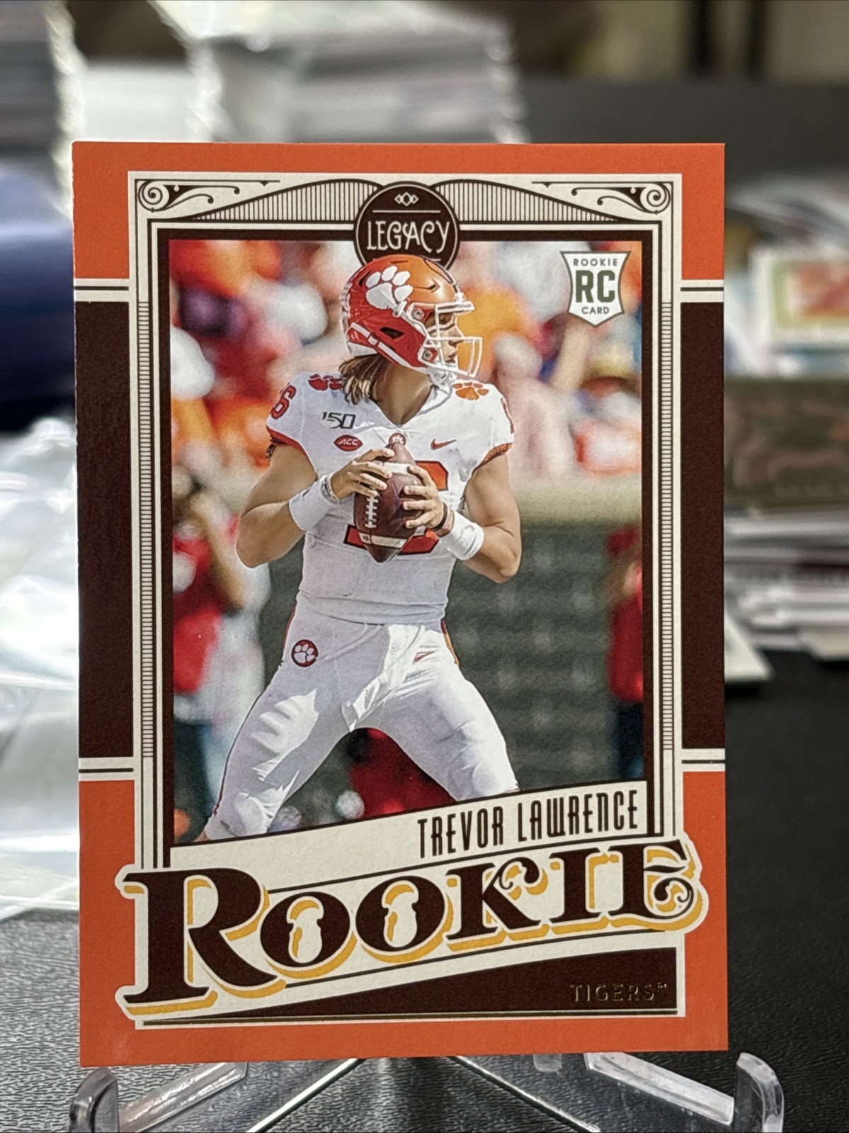 2021 Panini Legacy - Rookies Trevor Lawrence #141 Orange 146/199 (RC)