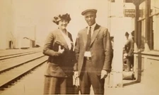 Real Photo Postcard Man and Woman RPPC Train Station a2-6