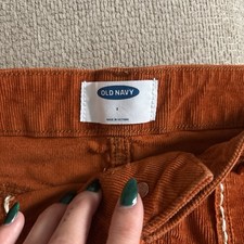 Vintage-inspired burnt orange corduroy mini skirt with embroidery