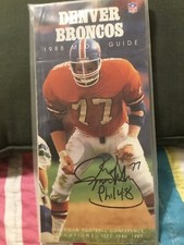 KARL MECKLENBURG SIGNED 1988 DENVER BRONCOS MEDIA GUIDE, #77