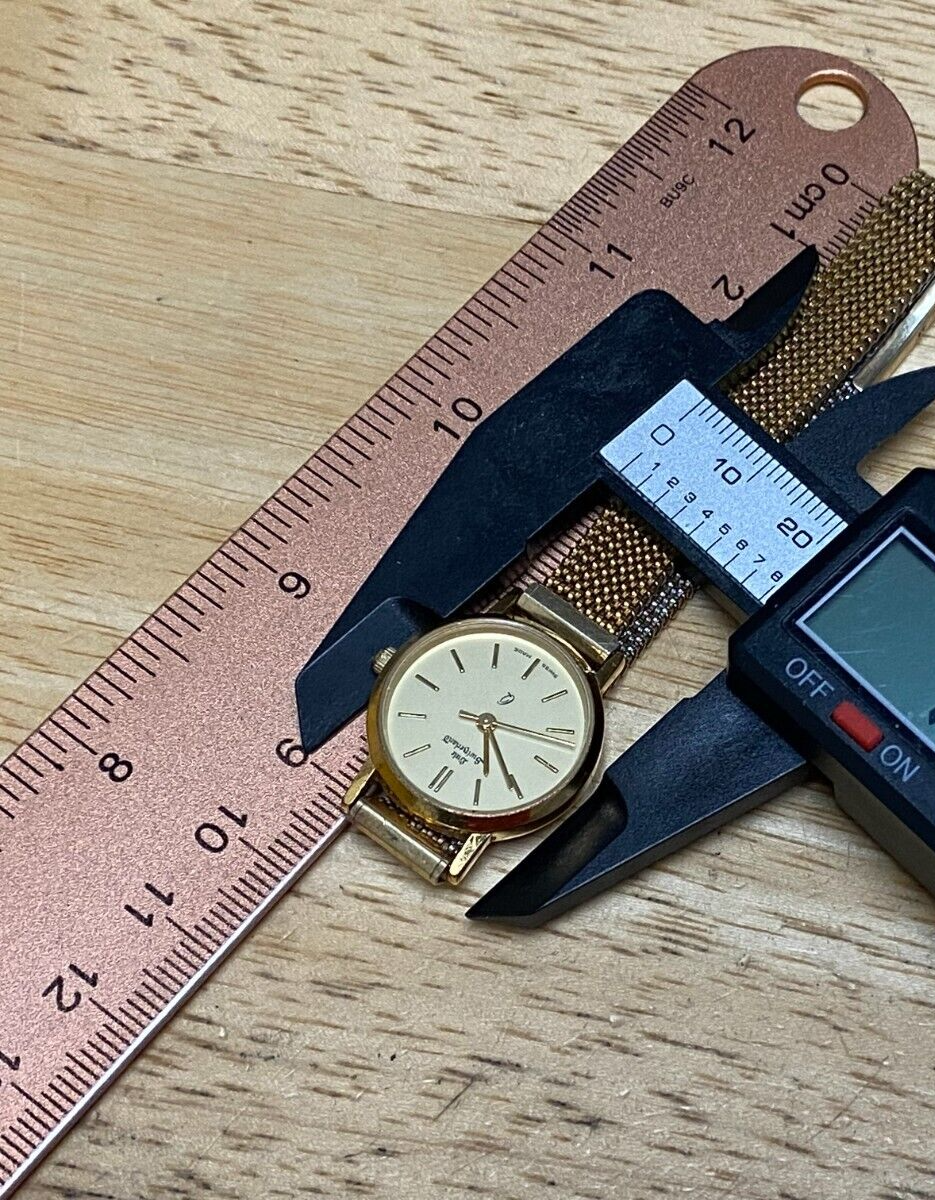 Vintage Little Switzerland Lady Gold Tone Swiss Analog 
