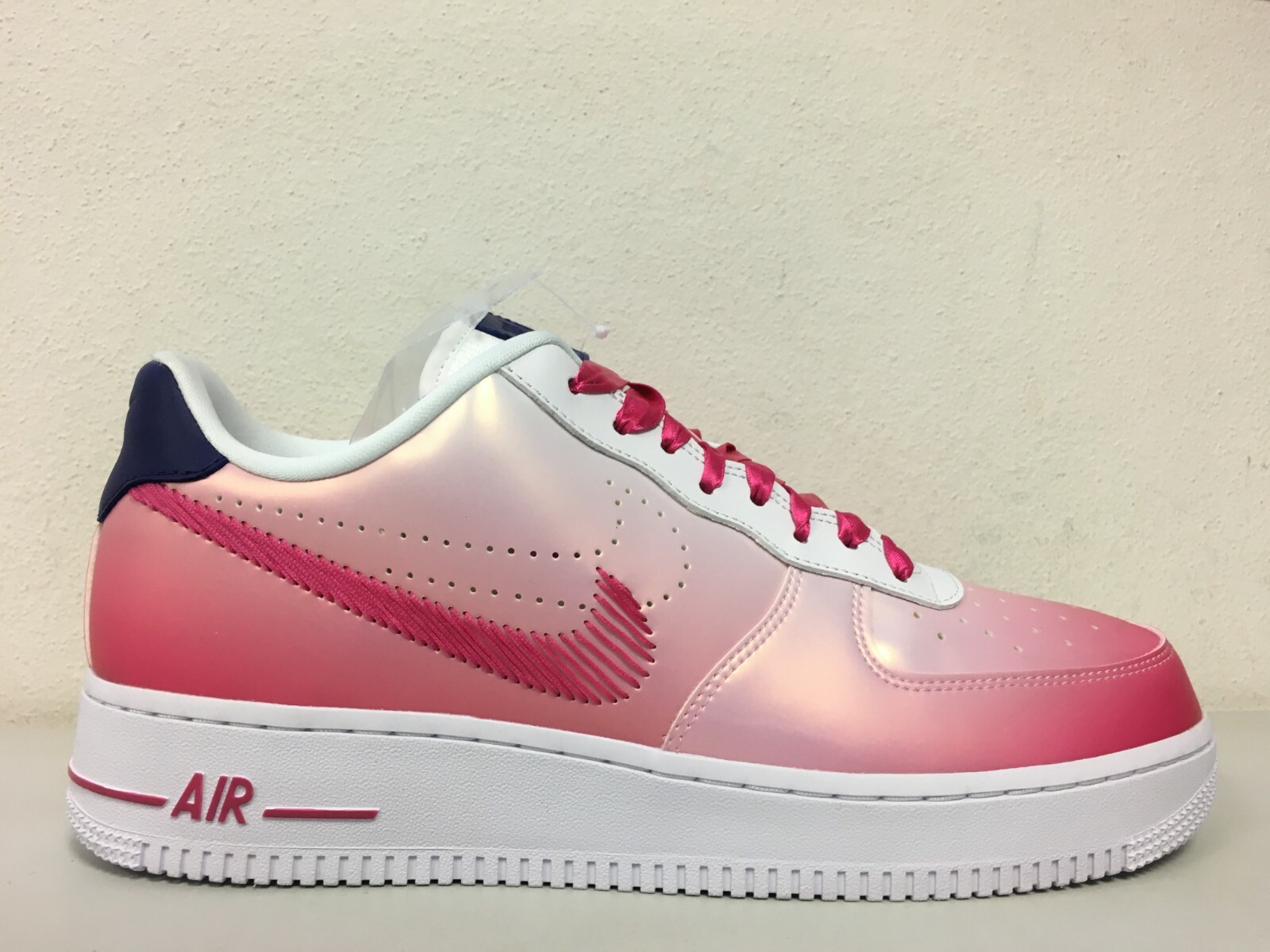 white nike air force with pink tick