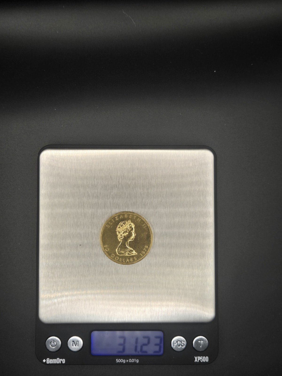 31+ grams.   Gold Maple Leaf Coin $50 BU - 1979 - Royal Canadian Mint .999 Gold