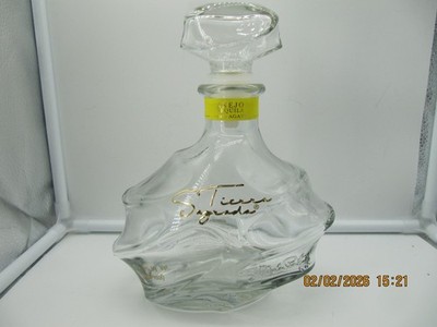 Empty Tierra Sagrada Anejo Tequila Bottle