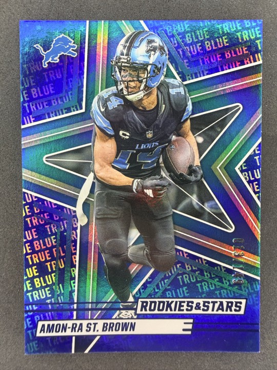2025 Panini Rookies & Stars - Amon-Ra St. Brown #69 True Blue /149