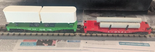 LIONEL O GAUGE - SET OF TWO FLAT CARS WITH LOADS; PW 6477 & MPC NP TRAILER CAR