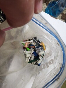 Bag of pool stick tips, chalk and golf tees.