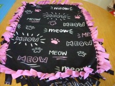 Handmade fleece tie blanket of meow paw print for a small pet