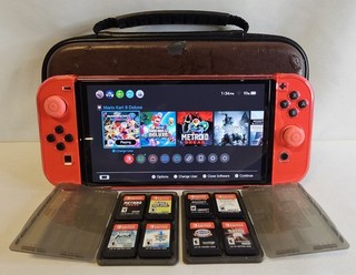 Nintendo Switch OLED Mario Red Version PLUS NINE GAMES AND CASE!!