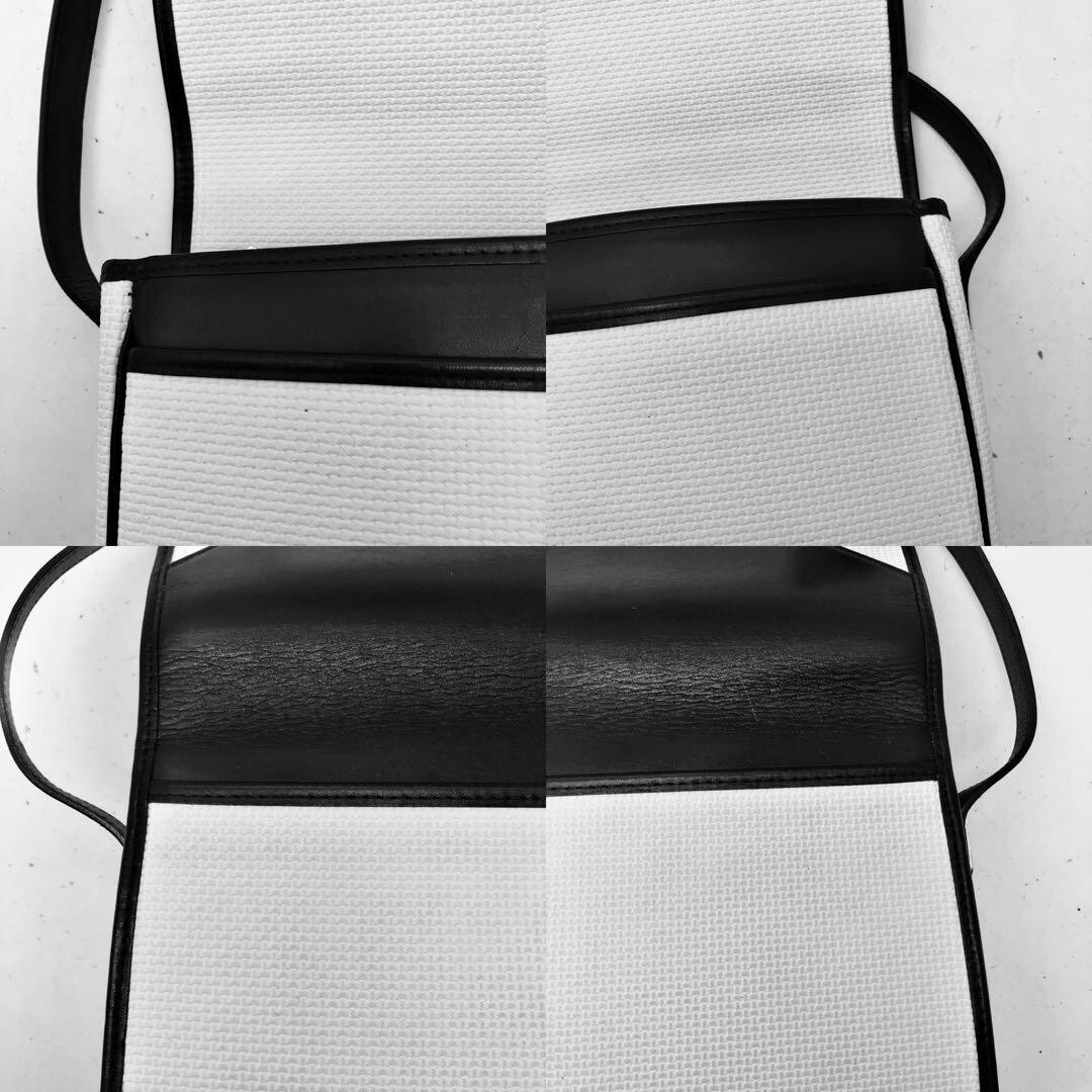 Borsa a tracolla Yves Saint Laurent pochette YSL bianca e nera usata pelle tela