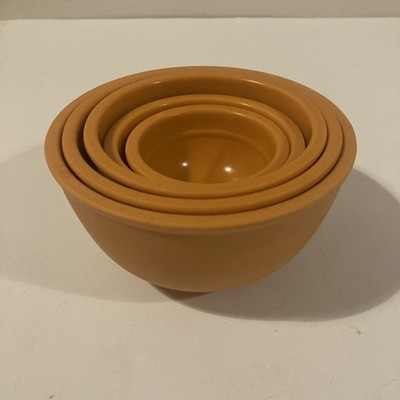 Authentic vintage Melmac nesting measuring cups in tangerine orange MCM
