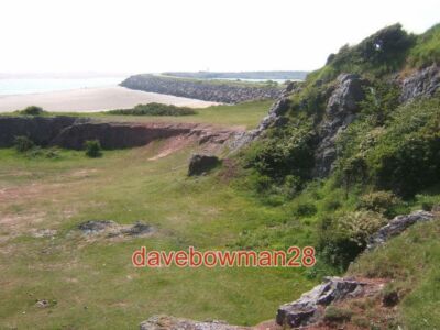 PHOTO  NEAR HODBARROW POINT SEA WALL CURVING AWAY IN THE DISTANCE 2006