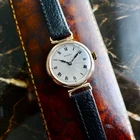 AN ANTIQUE 1925 9K GOLD ROLEX  MID-SIZE GUILLOCHE DIAL WATCH IN ITS ORIGINAL BOX