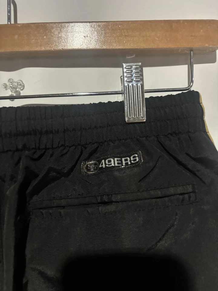 Pantalones cortavientos Reebok negros 49ers NFL talla L Foto 3 de 4
