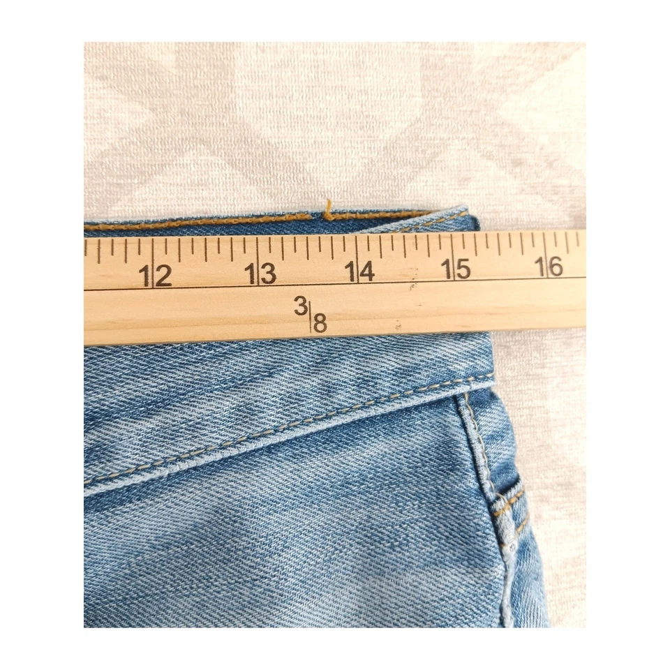 Pantalones Cortos de Denim Levi's 512 Corte Envejecido Rasgado Azul Para Mujer Talla 31x32 Foto 3 de 4