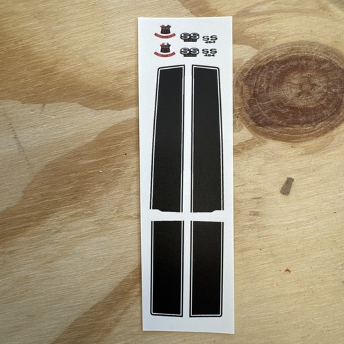Seven black vintage Chevelle Malibu SS 454 decals with dual stripes, sealed in clear plastic packaging.