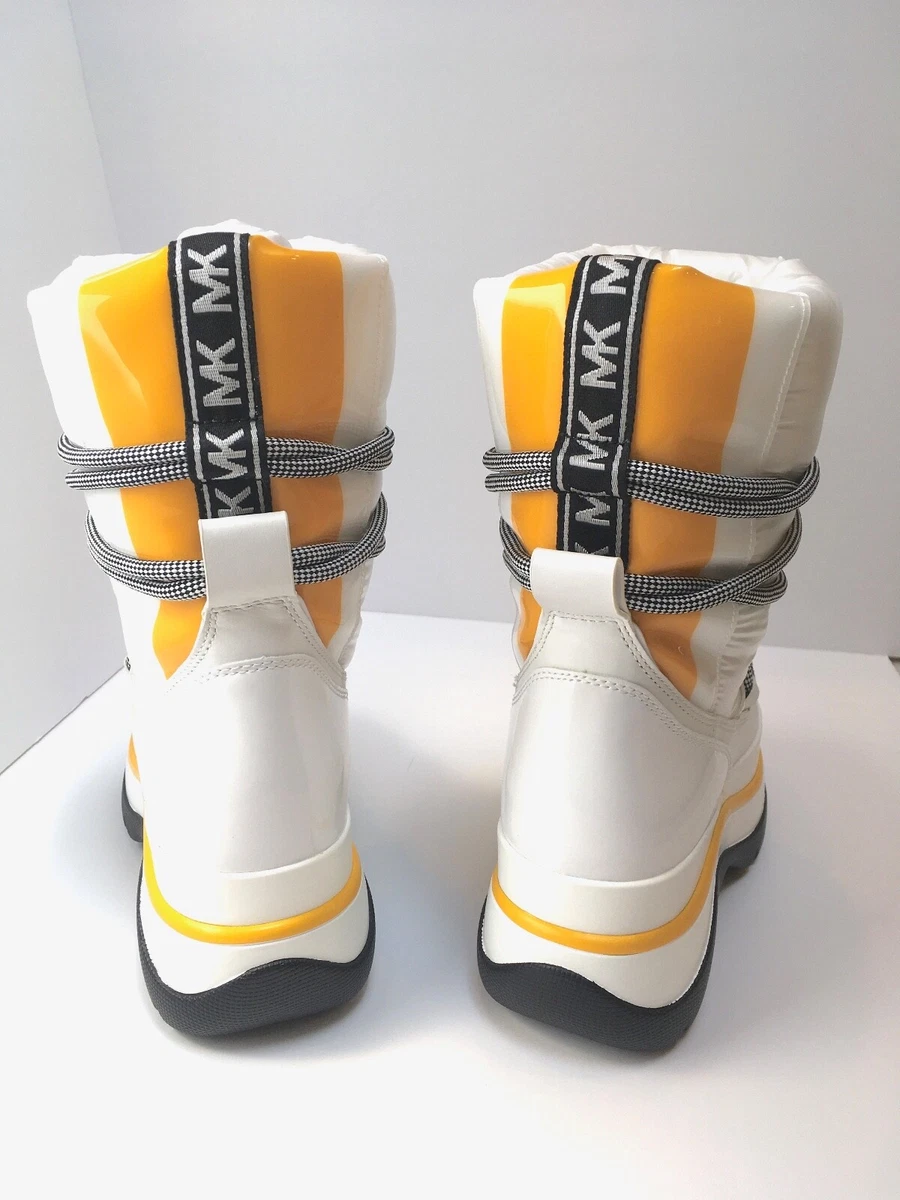 MICHAEL KORS ZADIE MIXED MEDIA MOON BOOTIE W LOGO TAPE AND MEDALLION IN WHITE 7M