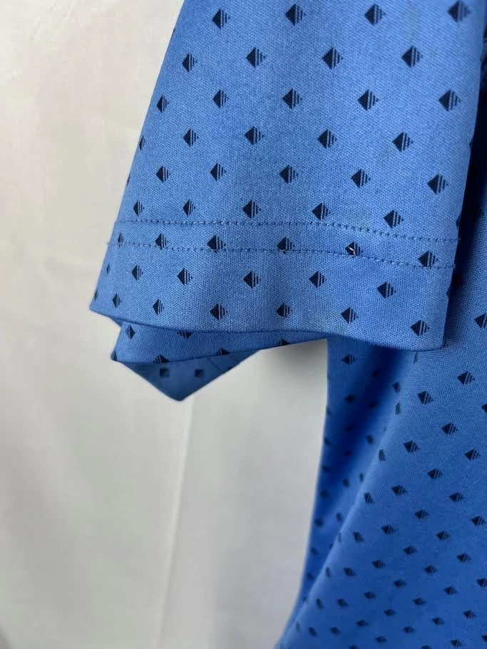 Polo de golf Greg Norman Play Dry azul lunares rendimiento para hombre talla pequeña Foto 4 de 4