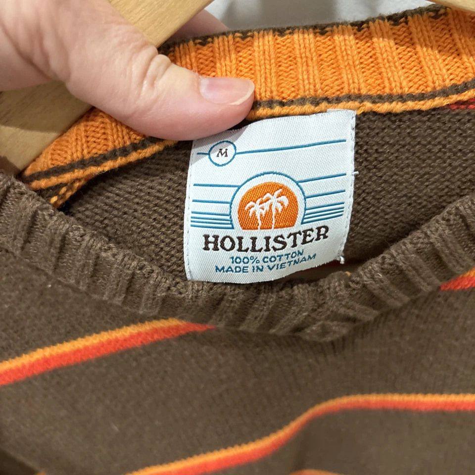 Suéter Hollister Cuello en V Marrón con Rayas Naranja Talla Mediana Foto 2 de 4