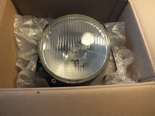 VW Golf 2 Frontscheinwerfer links mit Befestigungsblech und Leuchtmittel