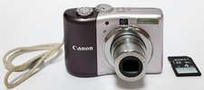 Canon PowerShot A1000 IS 10MP Digital Camera Silver Tested W/Batteries SD Card