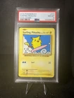 2016 POKEMON XY EVOLUTIONS #111 SURFING PIKACHU PSA 8